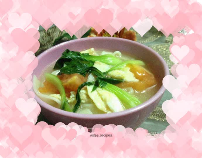 Tomato, greens and chicken noodle soup