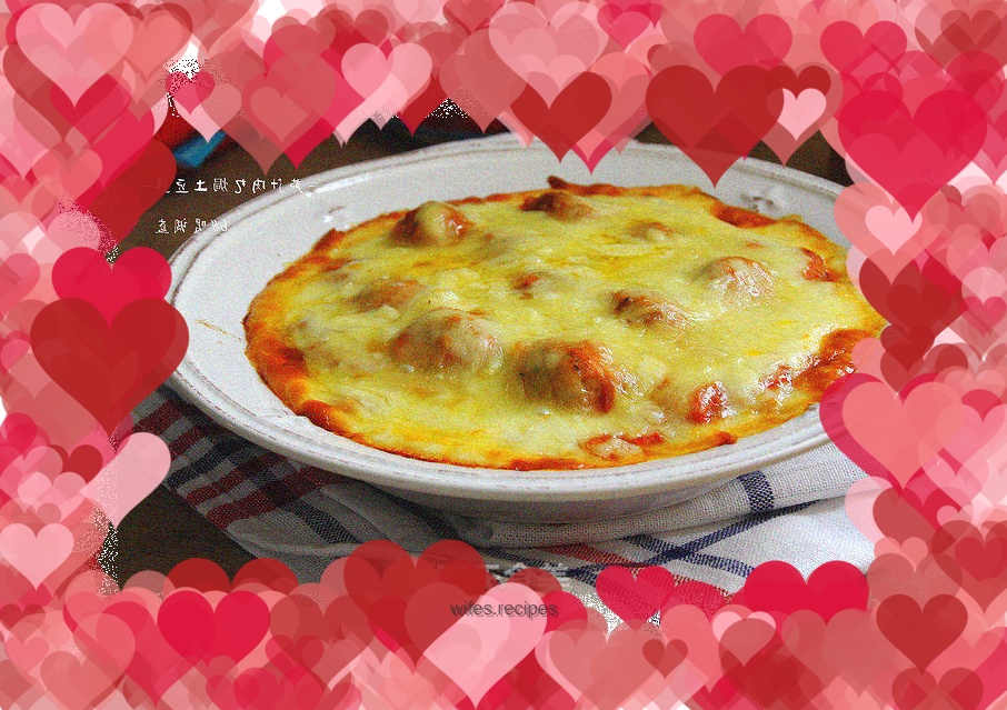 Baked mashed potatoes with tomato sauce and meatballs