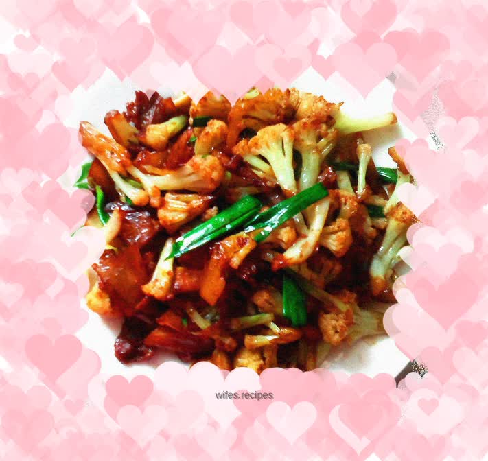 Stir-fried pork belly with green garlic sprouts and organic cauliflower