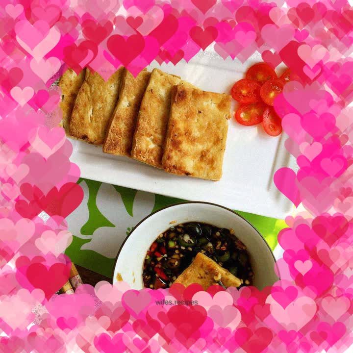 Crispy tofu dipped in sauce