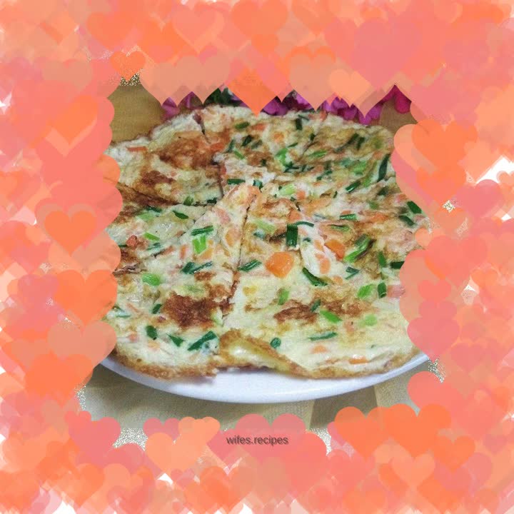 Fried eggs with carrots, spring onions