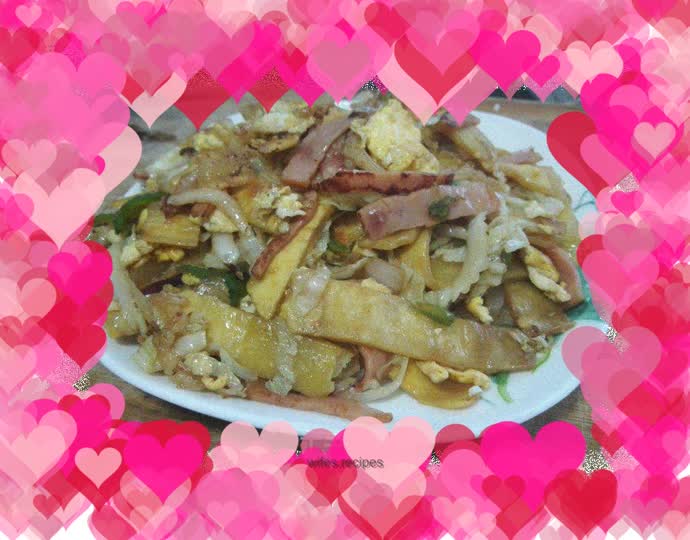 Fried pancakes with bacon, green pepper and cabbage
