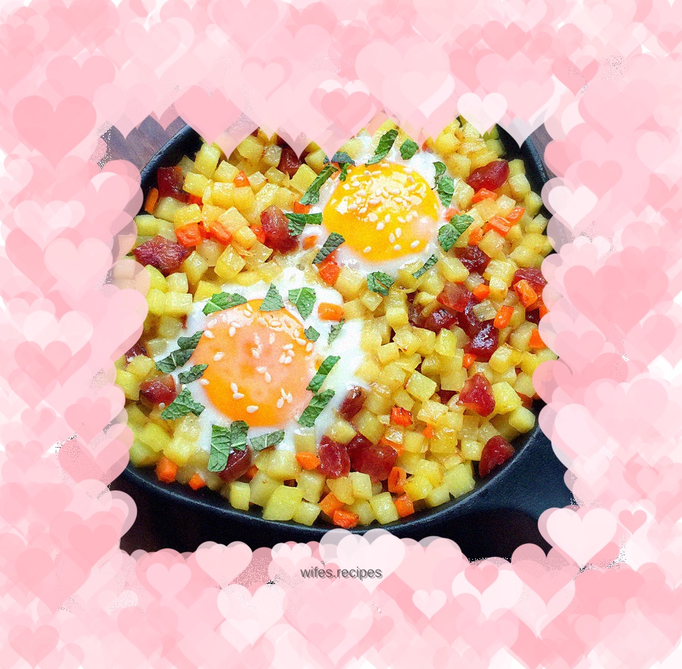 Baked eggs with potatoes, carrots and sausage