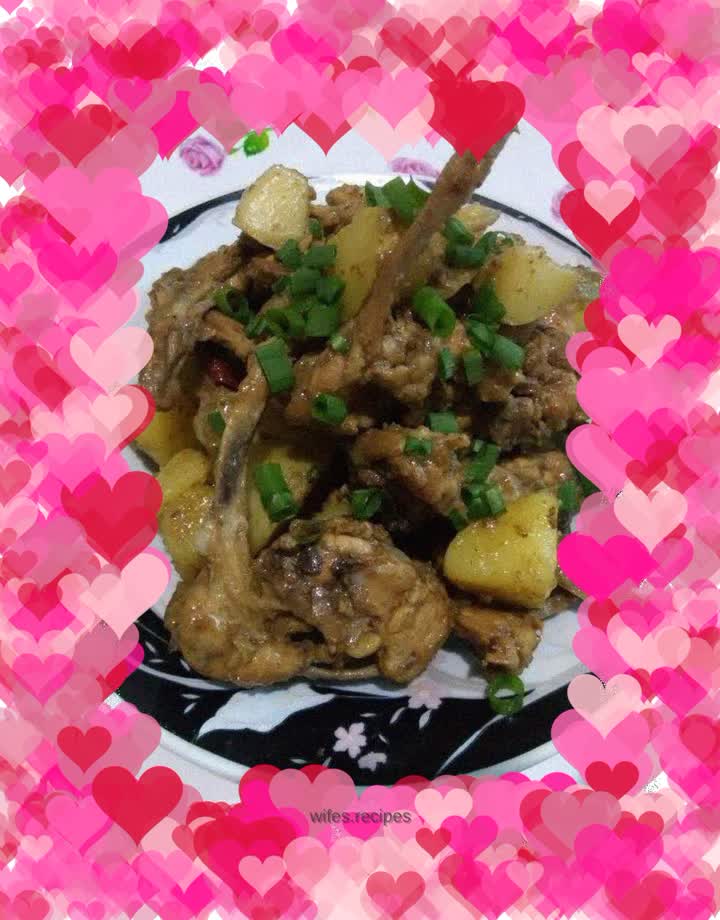 Stewed chicken carcass with potatoes garnished with chives