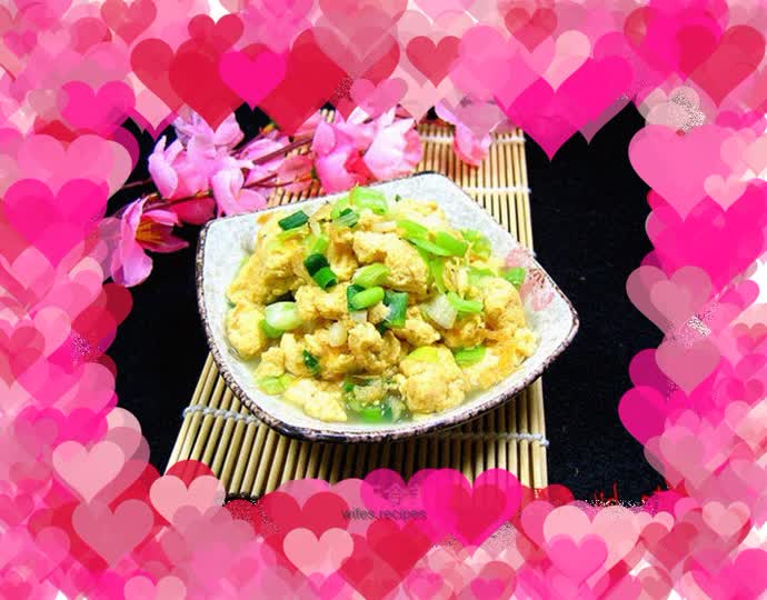 Healthy and oil-free—fried eggs with garlic sprouts and water