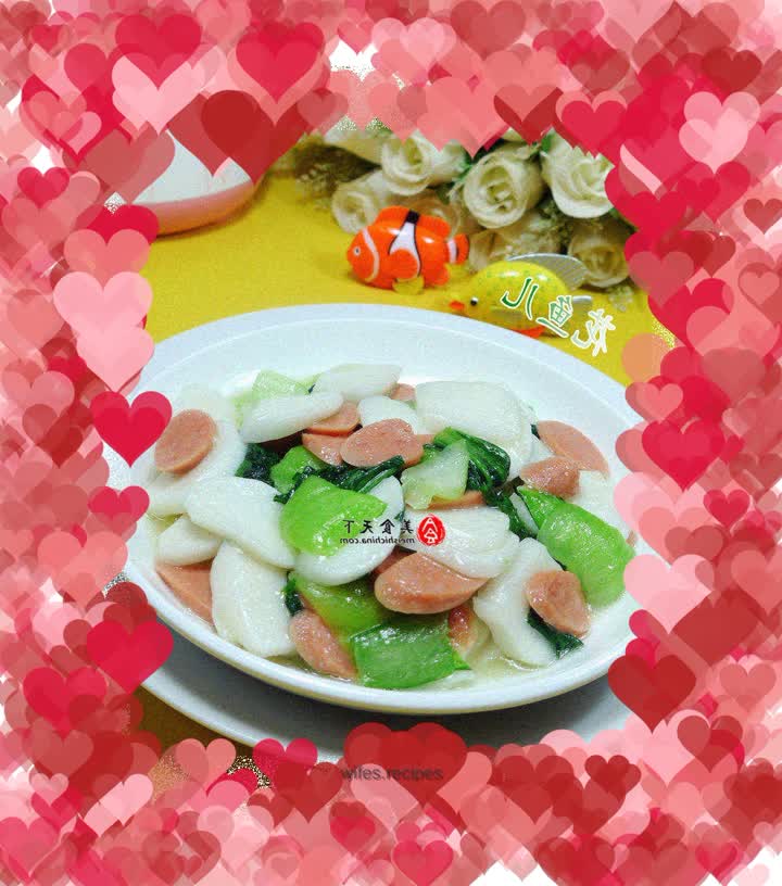 Fried rice cake with ham, sausage and vegetables