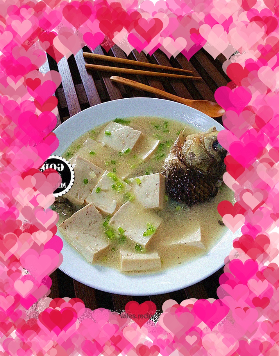 The national confinement meal on the Chinese dining table = crucian carp and tofu soup in preparation for the second child