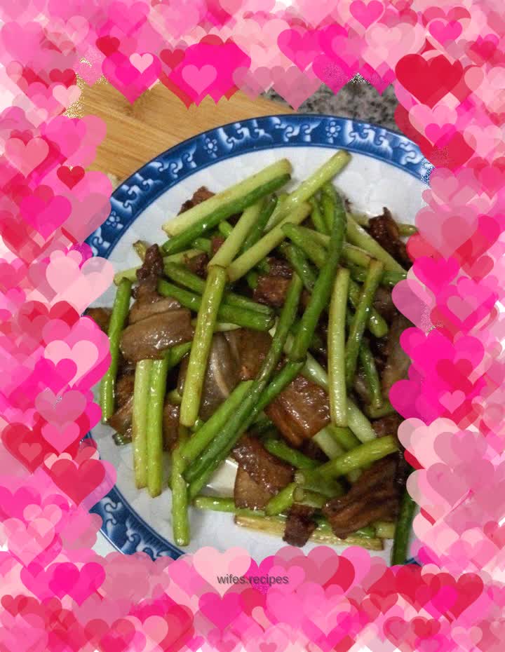 Stir-fried pork belly with garlic sprouts