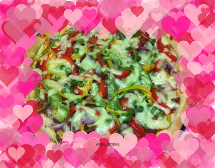 Ham and vegetable pizza