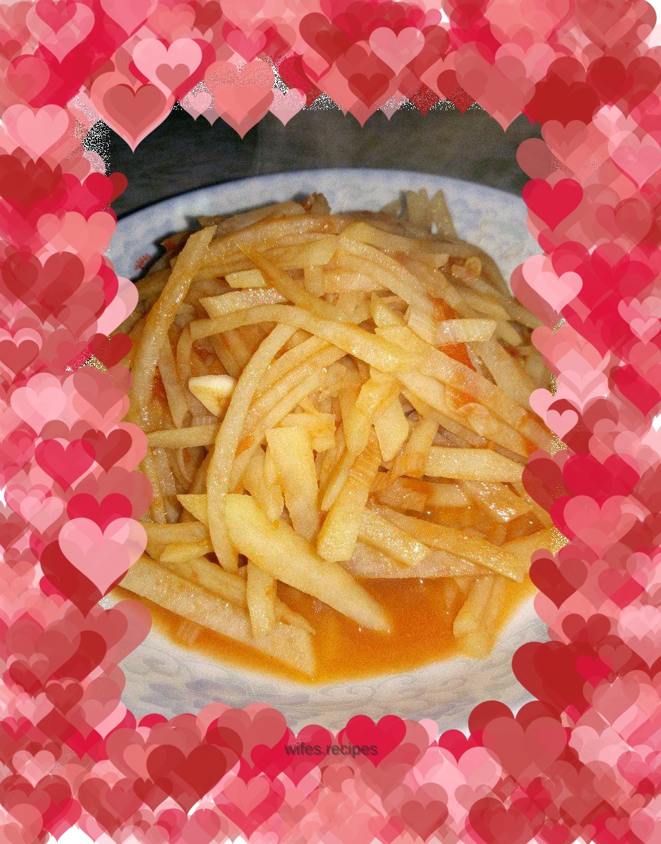 Fried potatoes with tomatoes