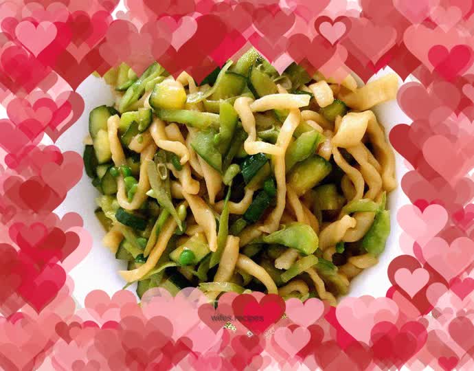Fried hand-made noodles with snow peas and cucumbers