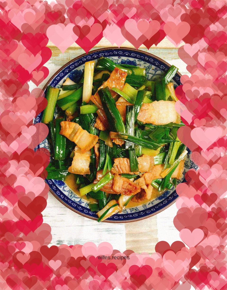 Stir-fried pork belly with garlic sprouts